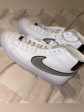 Nike White Sneakers with Silver Swoosh Accent